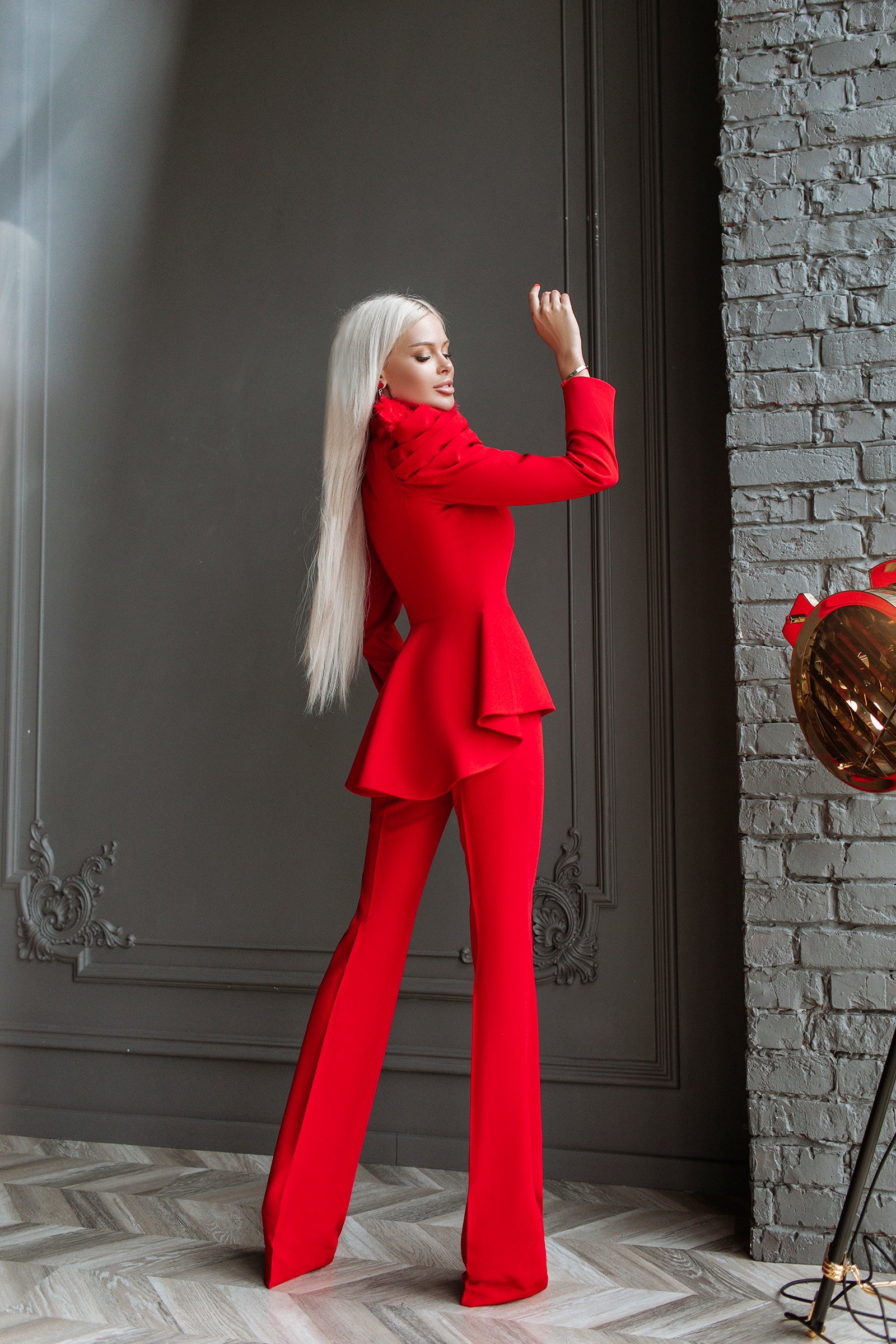 Pants Suit with Voluminous Shoulders and a Basque
